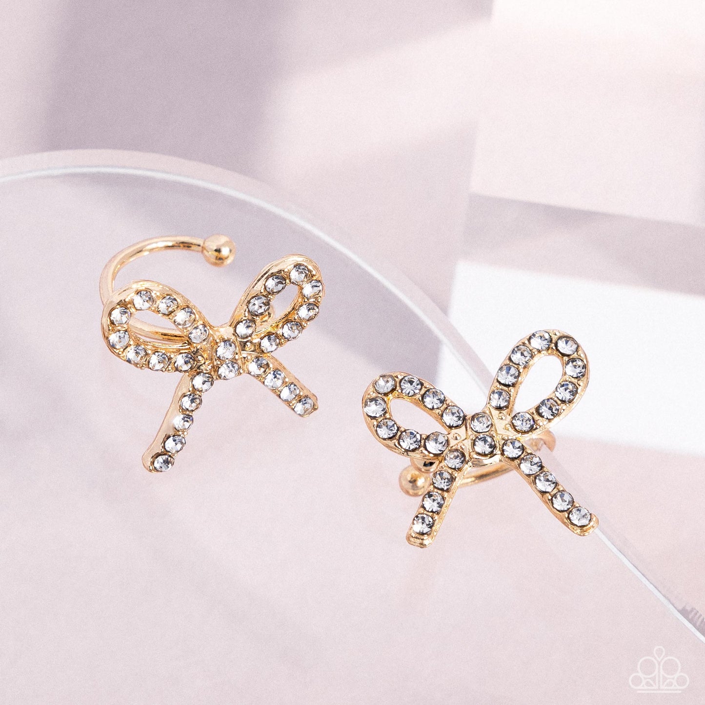 Convincing Charm - Gold Bow Ear Cuff Earrings - Paparazzi Accessories