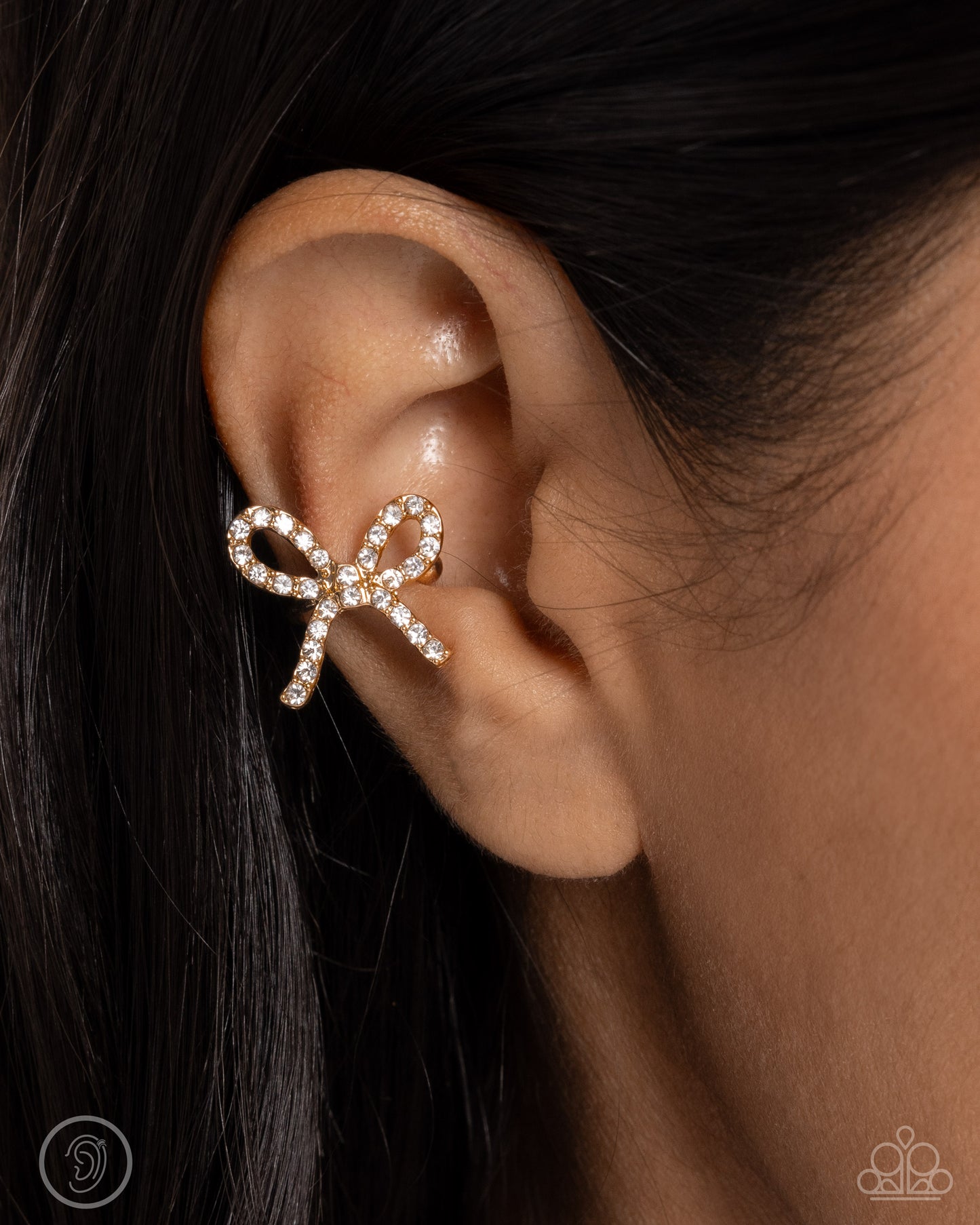 Convincing Charm - Gold Bow Ear Cuff Earrings - Paparazzi Accessories
