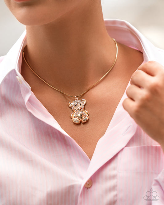 Cuddly Chic - Gold & White Rhinestone Teddy Bear Pendant Necklace - Paparazzi Accessories