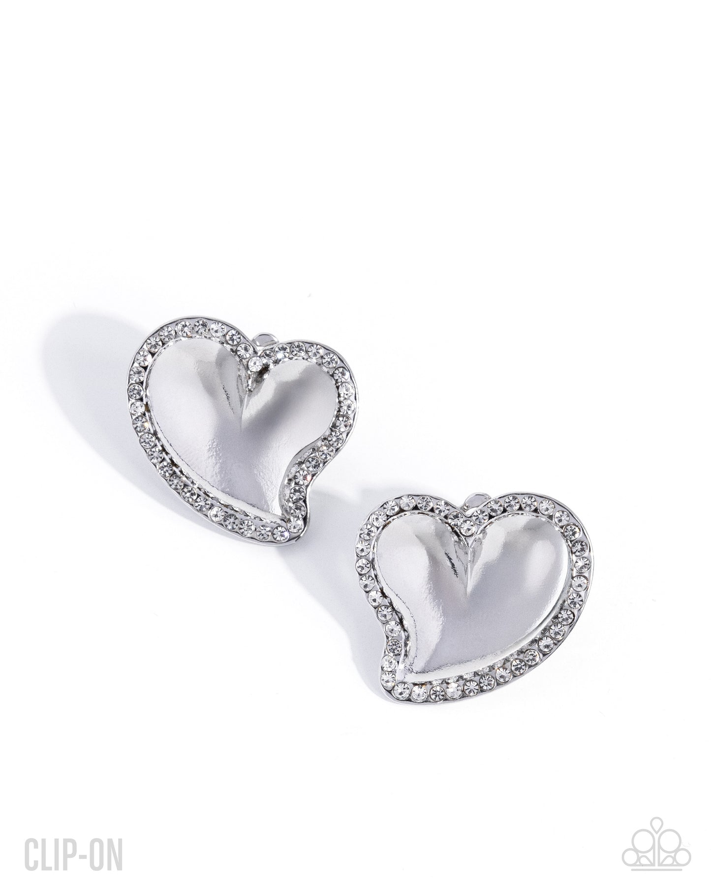 Loveable Luminescent - White Rhinestone, Silver Heart Clip-on Earrings - Paparazzi Accessories