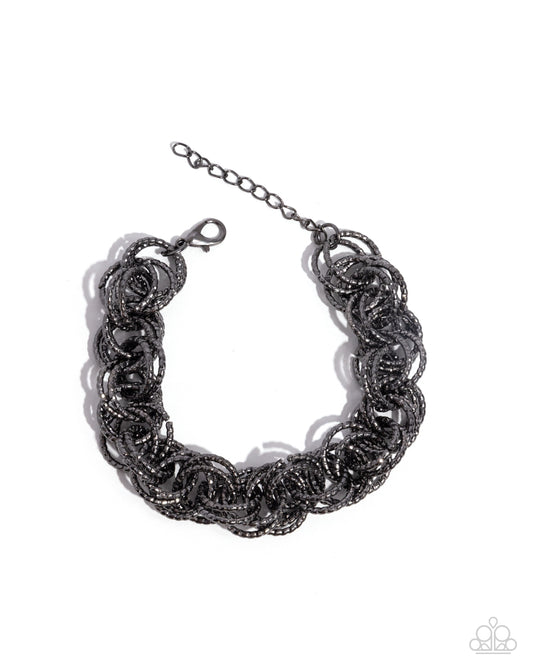 Audible Shimmer - Black Clasp Bracelet - Paparazzi Accessories