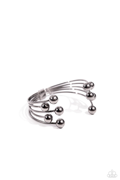 Assembly Line - Black - Gunmetal Cuff Bracelet - Paparazzi Accessories