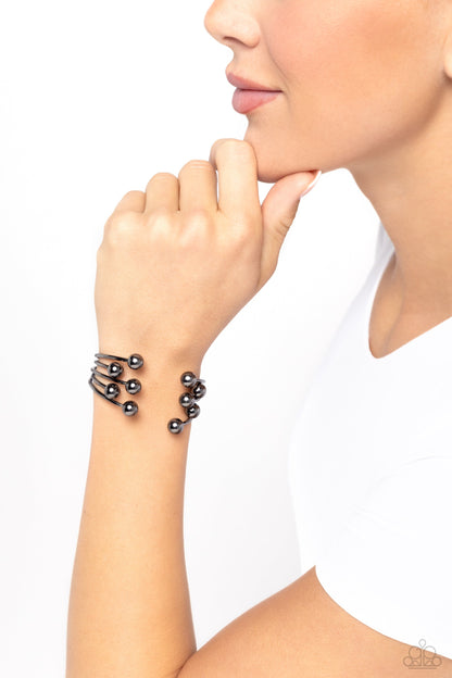 Assembly Line - Black - Gunmetal Cuff Bracelet - Paparazzi Accessories