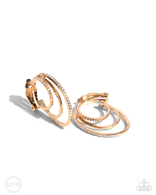 Triad Trek - Gold Clip-on Hoop Earrings - Paparazzi Accessories