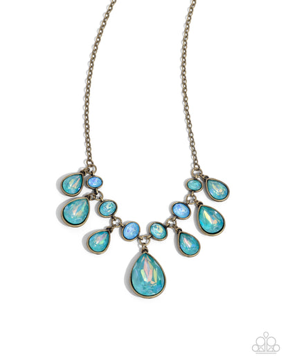 Talented Teardrops - Brass & Blue Zircon UV Gem Necklace - Paparazzi Accessories