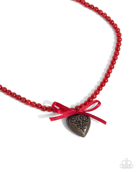 Tasteful Trimming - Red Beaded Satin Bow Brass Heart Pendant Necklace - Paparazzi Accessories