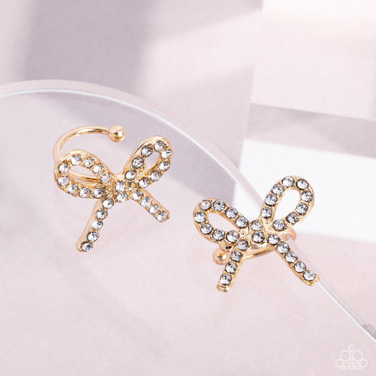 Convincing Charm - Gold Bow Ear Cuff Earrings - Paparazzi Accessories