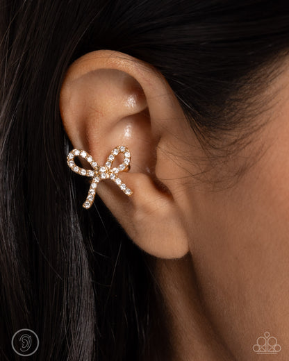 Convincing Charm - Gold Bow Ear Cuff Earrings - Paparazzi Accessories