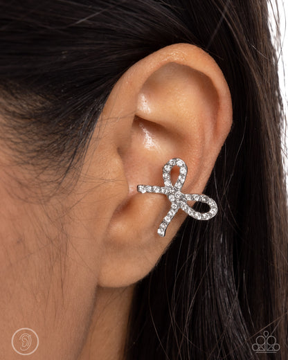 Convincing Charm - White Rhinestone Silver Bow Ear Cuff Earrings - Paparazzi Accessories