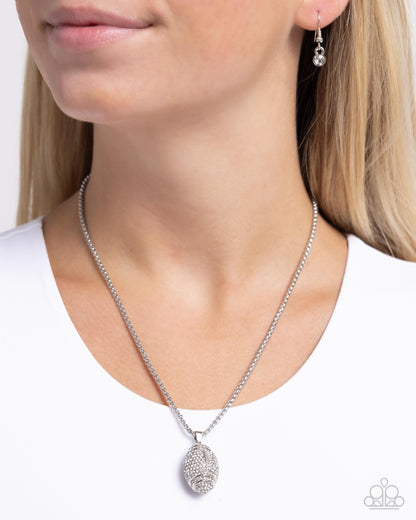 End Zone Elegance - White Rhinestone Football Pendant Necklace - Paparazzi Accessories