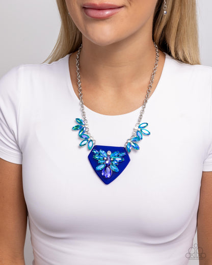 Scintillating Shield - Blue Opalescent Rhinestone Necklace - Paparazzi Accessories