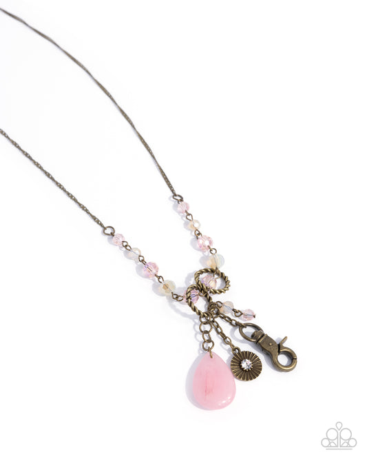 Early Childhood - Brass, Iridescent Crystal, & Pink Teardrop Stone Lanyard Necklace - Paparazzi Accessories