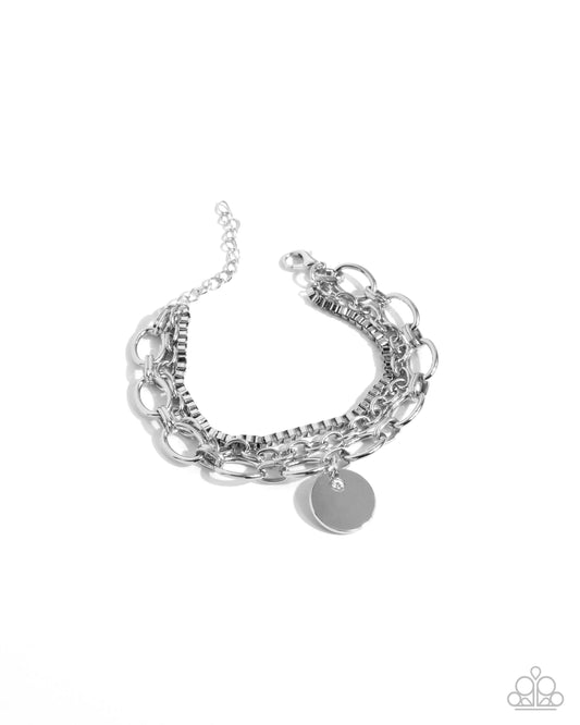 Coined Confidence - White Rhinestone Silver Charm Clasp Bracelet - Paparazzi Accessories
