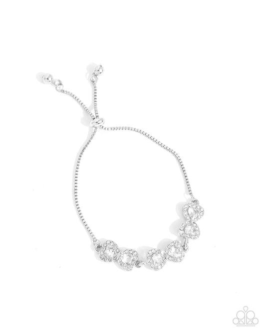 Angelic Afterlife - White Rhinestone Hearts Silver Sliding Bead Closure Bracelet - Paparazzi Accessories