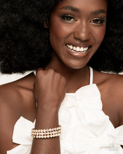 Iridescent Incantation - Gold & Iridescent Rhinestone Coil Bracelet - Paparazzi Accessories