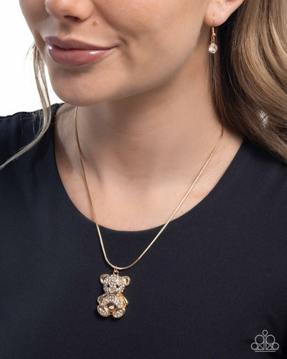 Cuddly Chic - Gold & White Rhinestone Teddy Bear Pendant Necklace - Paparazzi Accessories