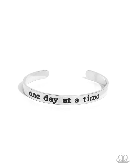 Day By Day Delight - Silver "one day at a time" Cuff Bracelet - Paparazzi Accessories