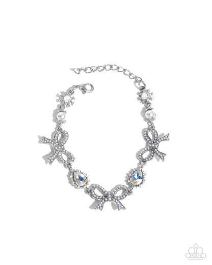 Coquette Caliber - White Pearl Bow Iridescent Rhinestone Silver Clasp Bracelet - Paparazzi Accessories