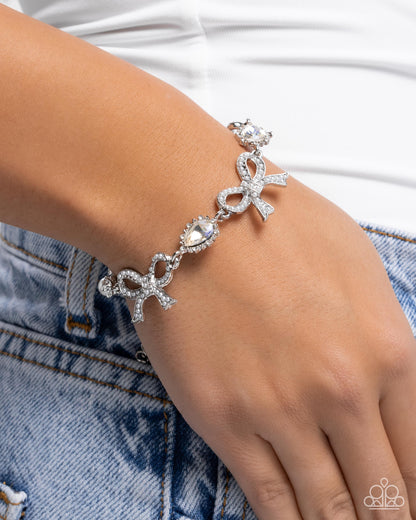 Coquette Caliber - White Pearl Bow Iridescent Rhinestone Silver Clasp Bracelet - Paparazzi Accessories
