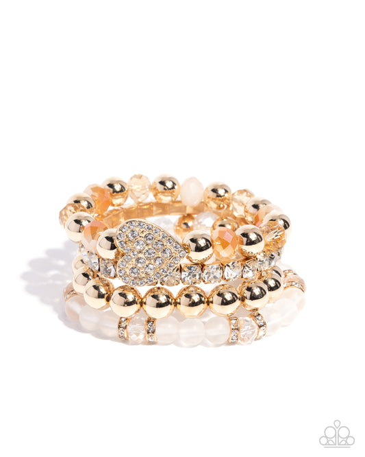 Poetically Plush - White Rhinestone Heart Gold Stretchy Bracelets - Paparazzi Accessories