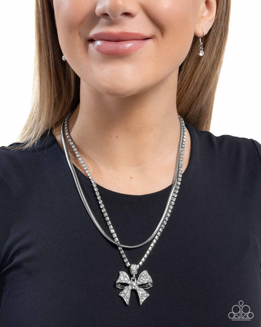 Cheerful Coquette - White Rhinestone Bow Layered Silver Necklace - Paparazzi Accessories