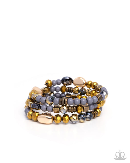 Material WHIRL - Brass UV Shimmer Coil Bracelet - Paparazzi Accessories