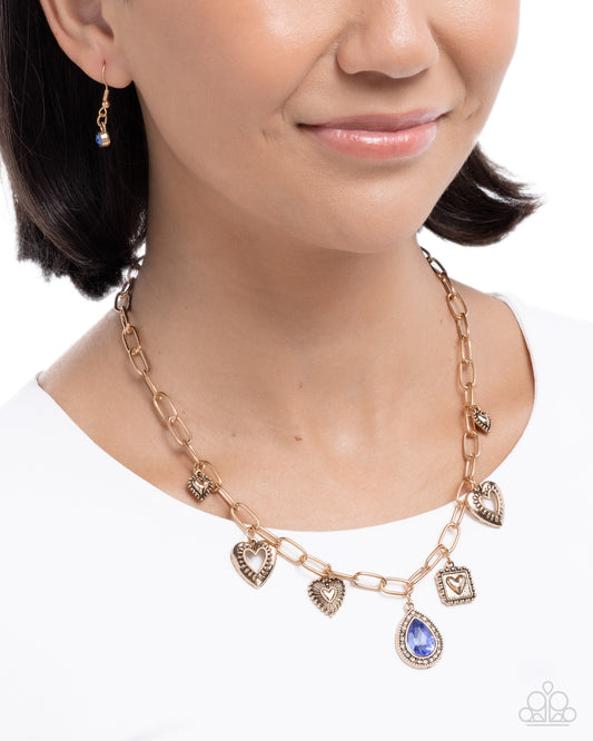 Flirtatious Framing - Blue Rhinestone Gold Neckalce - Paparazzi Accessories