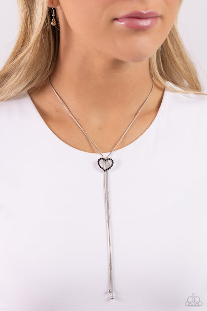 Tempting Tassel - Black Rhinestone Heart Bolo Slide Necklace - Paparazzi Accessories