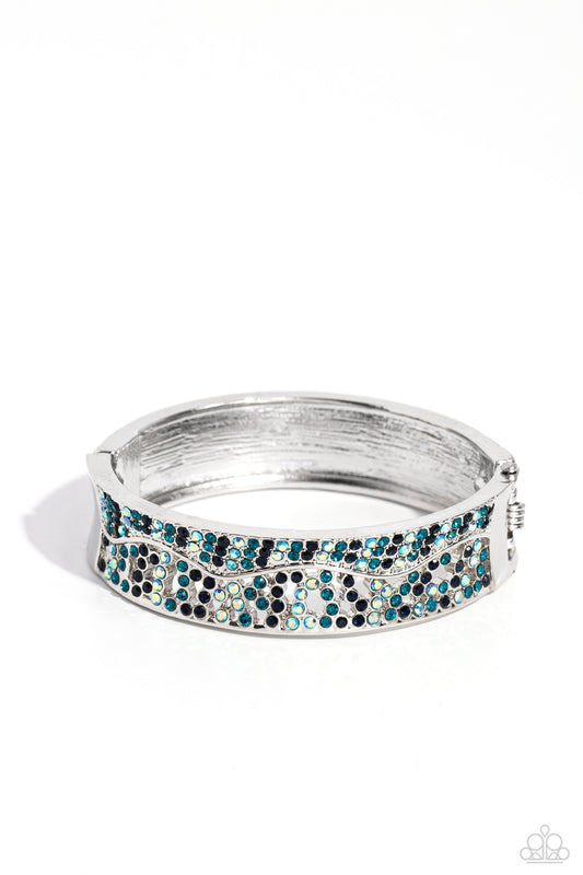 Wavy Whimsy - Blue Iridescent Rhinestone Hinge Bracelet - Paparazzi Accessories